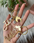 Couple Keychains made as a wedding gift . It has a Melbourne map cut out in which they have their wedding dates engraved .Each name has one part of the map it looks complete once they are put together. It also has their profession charms and 1 couple charm connected along with map cut outs.Vidita is a doctor by profession hence we connected 1 stethoscope and josh likes playing voilin . Get your customised keychains from Zatpat Bazar soon.