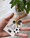 Football with Game console and an Initial Charm Keychain