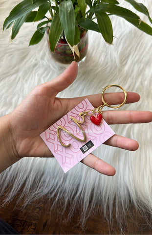 Metal initial with charm